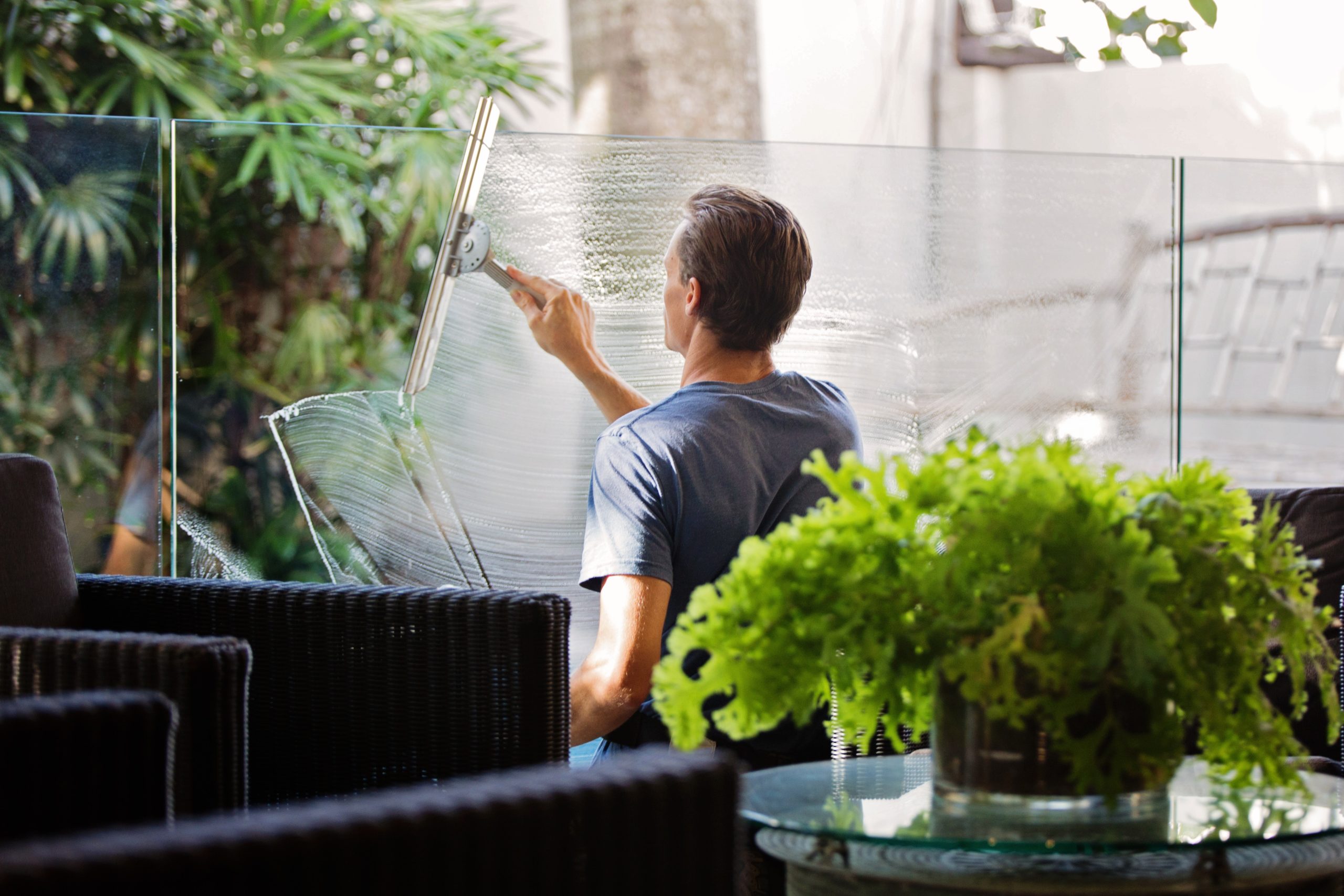 Maintenance Man Cleaning Window