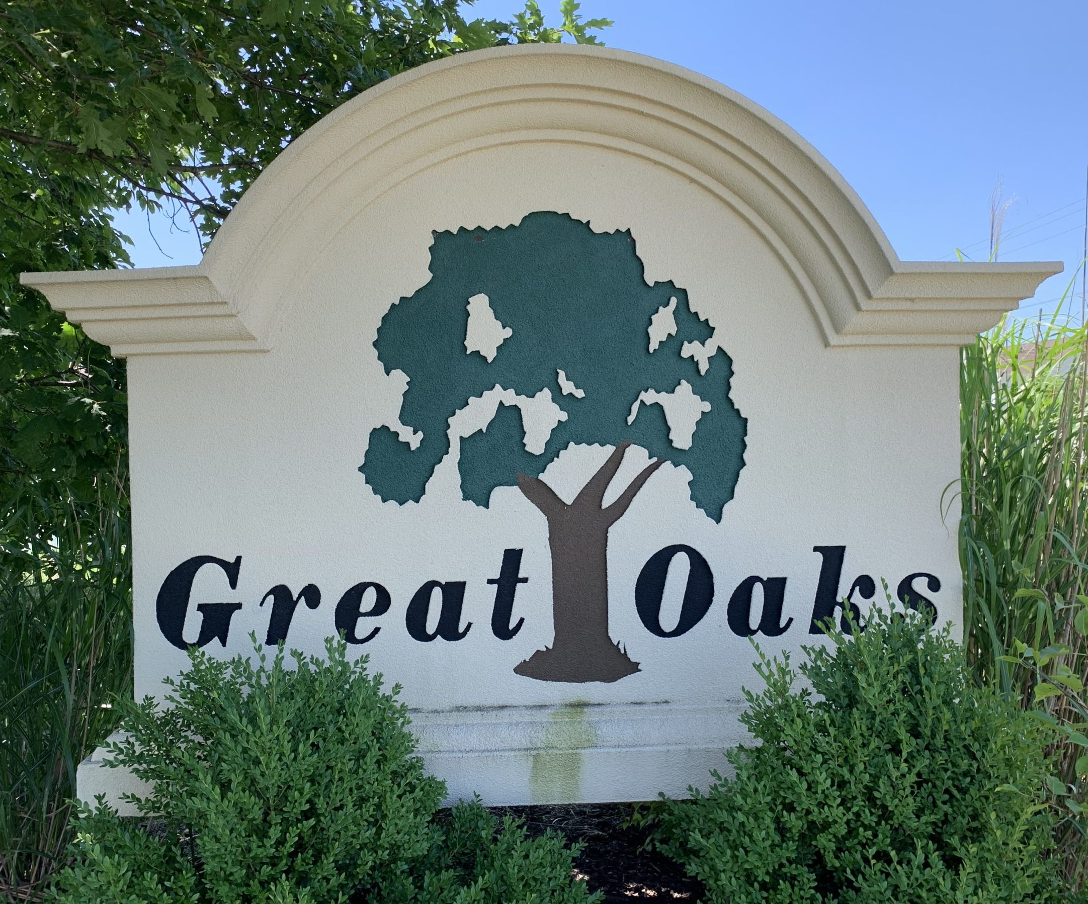 Large White Sign Reading Great Oaks