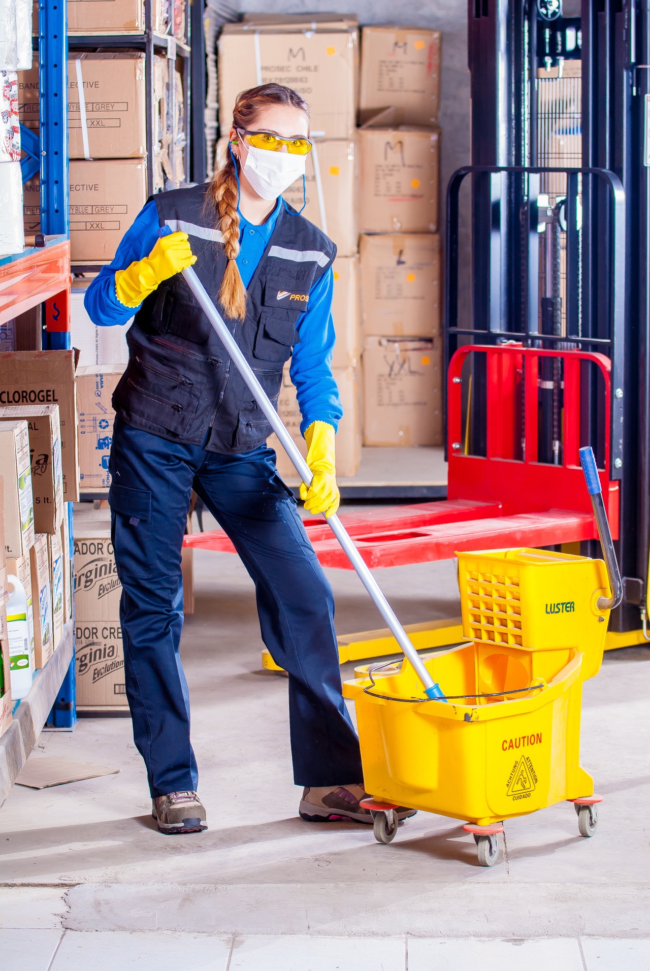 Masked Janitor Mopping Floor